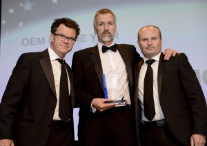 Standing from left are: Dominic Holland, master of ceremonies at the TCS&D Awards;  Stephen Williams, Thermo King and Arran Leatherland of IMS Ltd who presented the award. 