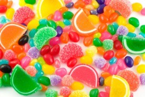 An assortment of colorful candy on full frame background with jellybeans, gumdrops and other jelly candies